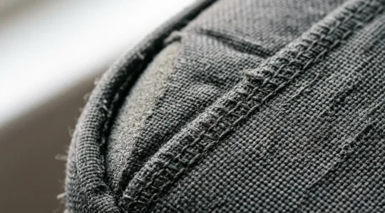 Close-up view of a mobility scooter seat showing proper width measurement and cushion placement to prevent pressure sores during long journeys