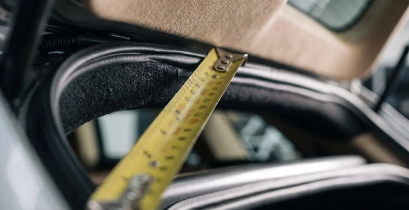Close-up view showing the clearance arc path a mobility scooter travels when lifted by a car boot hoist