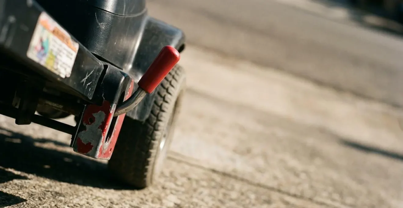 Symbolic representation of a mobility scooter neutral lever in disengaged position with visual metaphor emphasizing the defeated safety mechanism
